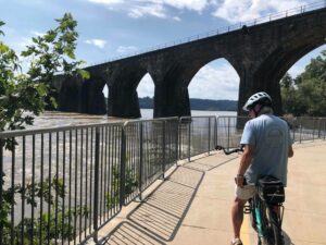 bike rider near bridge