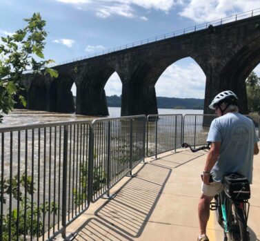 bike rider near bridge