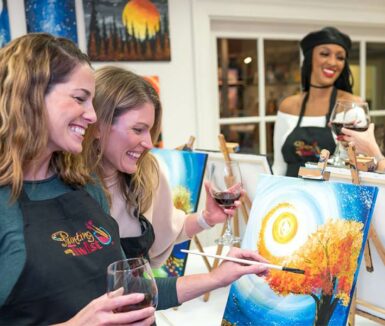 women with wine and art