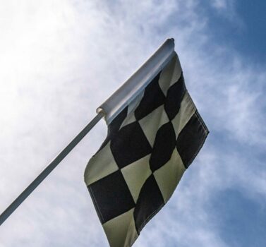 Racing flag up in the sky | Maple Grove raceway